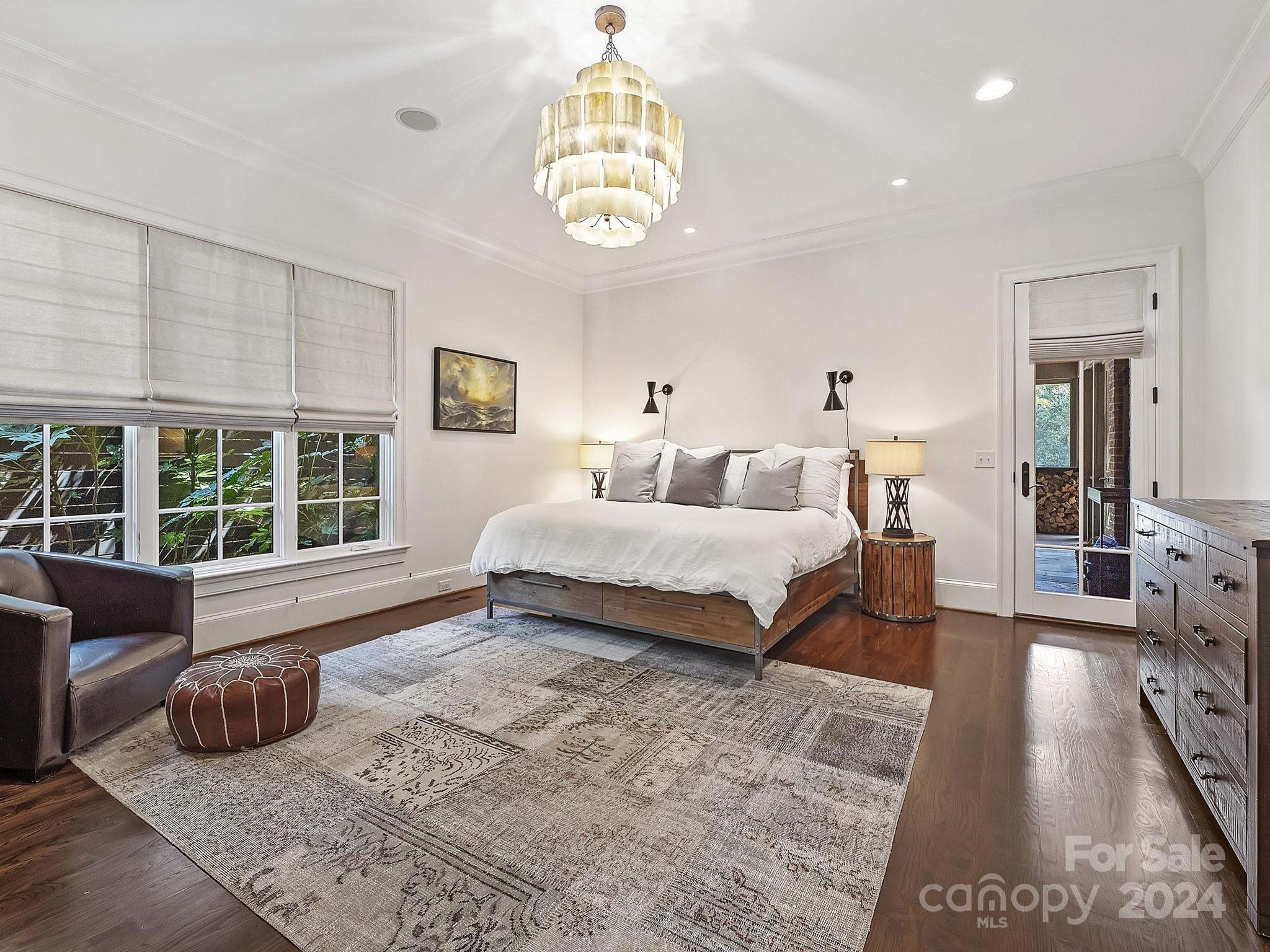 1621 Sterling Road Charlotte, NC 28209 - Photo 22 of 48 a spacious bedroom with a bed and a large window