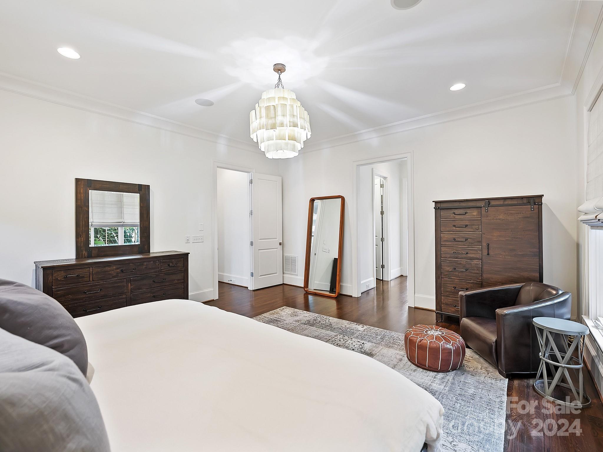 1621 Sterling Road Charlotte, NC 28209 - Photo 23 of 48 a bedroom with a bed and wooden floor