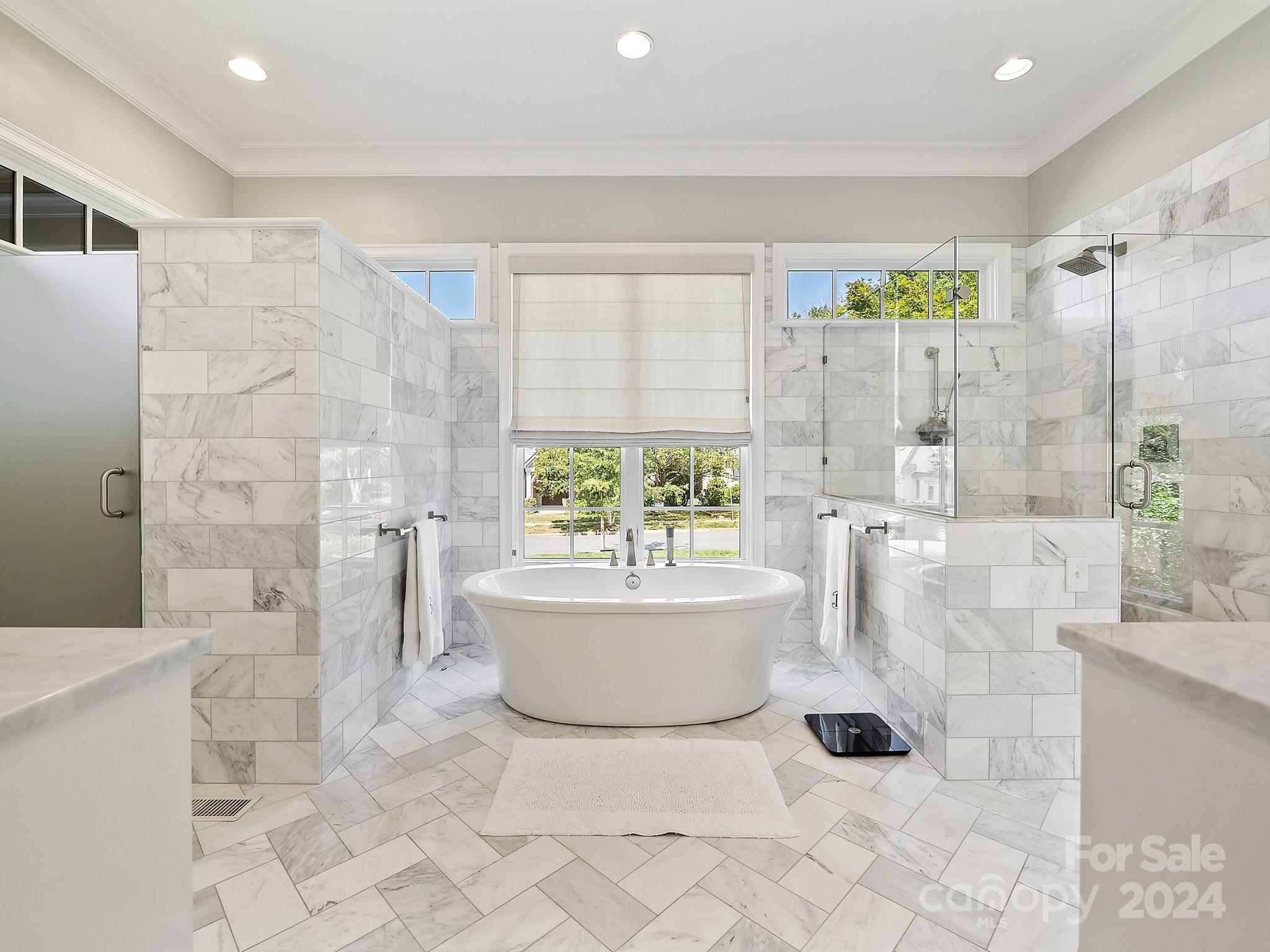 1621 Sterling Road Charlotte, NC 28209 - Photo 24 of 48 a bathroom with a bathtub and a shower