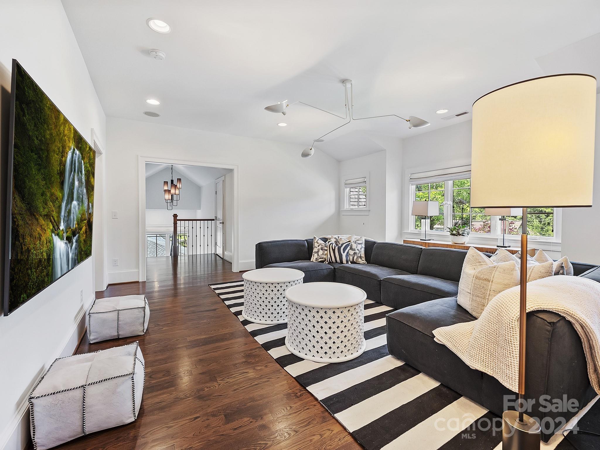1621 Sterling Road Charlotte, NC 28209 - Photo 26 of 48 a living room with furniture and a flat screen tv