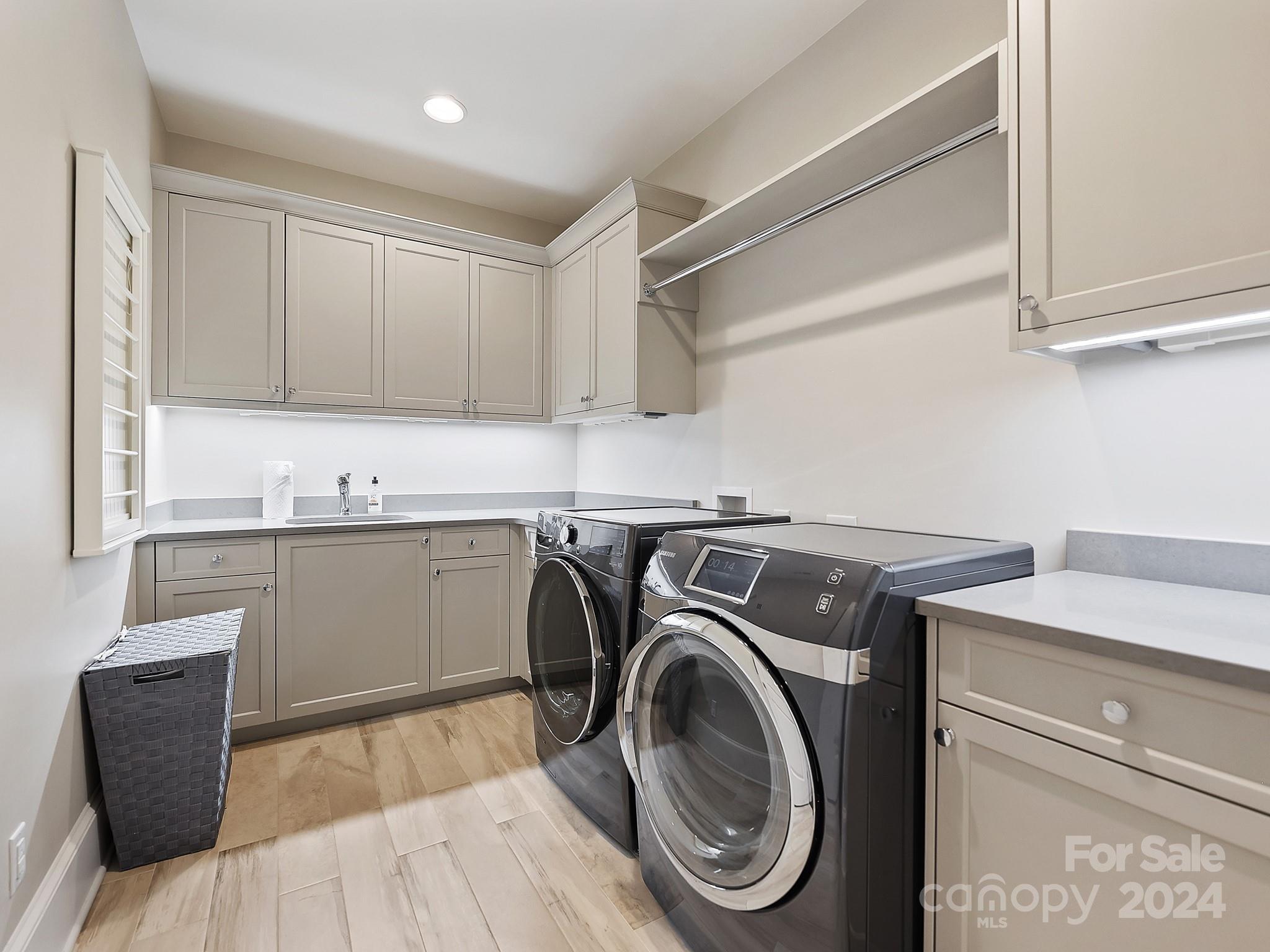 1621 Sterling Road Charlotte, NC 28209 - Photo 28 of 48 a utility room with sink dryer and washer