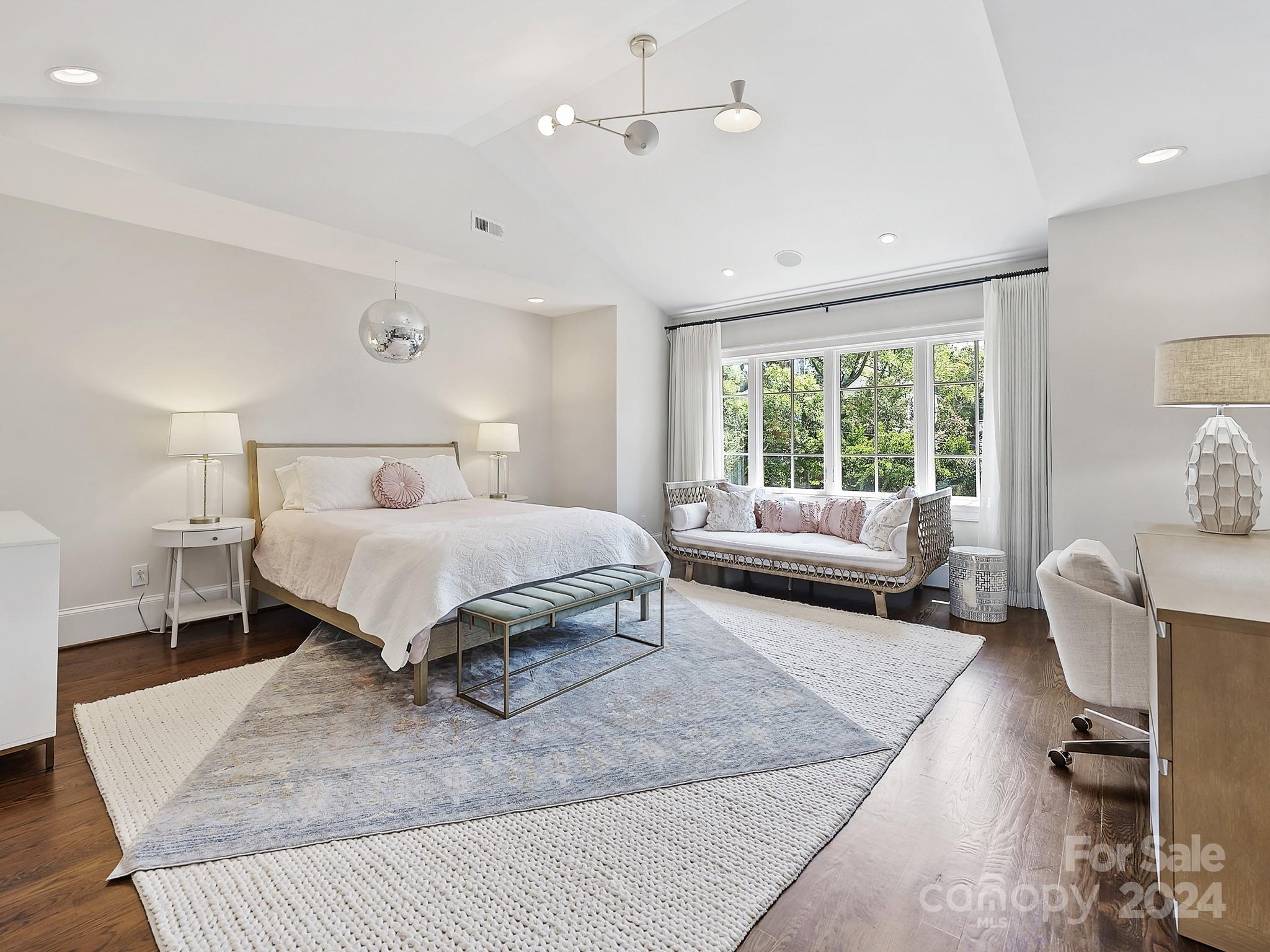 1621 Sterling Road Charlotte, NC 28209 - Photo 29 of 48 a bedroom with a bed a couch and a window