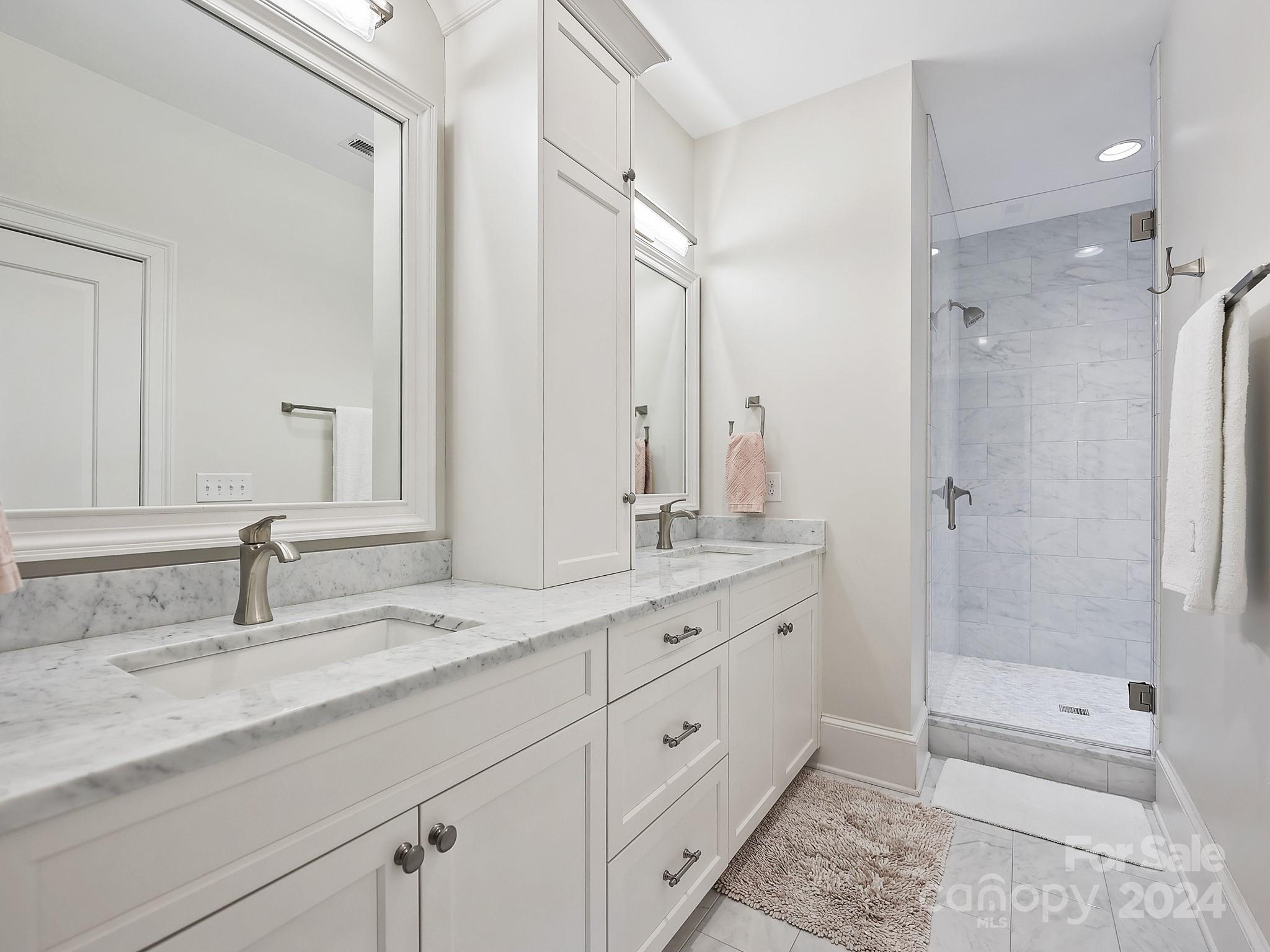1621 Sterling Road Charlotte, NC 28209 - Photo 30 of 48 a bathroom with 2 sink tub and a shower
