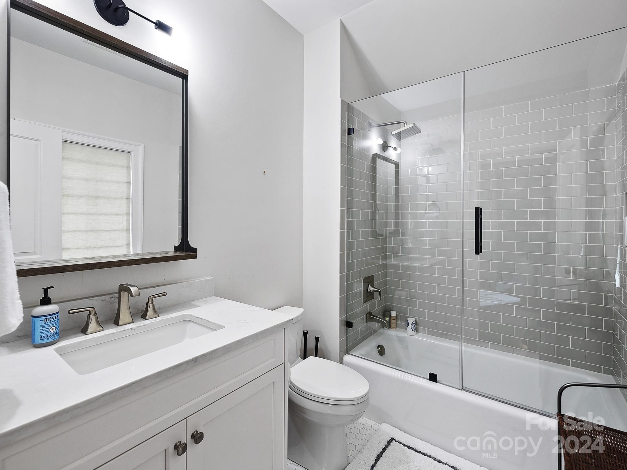 1621 Sterling Road Charlotte, NC 28209 - Photo 32 of 48 a bathroom with a sink a toilet and shower