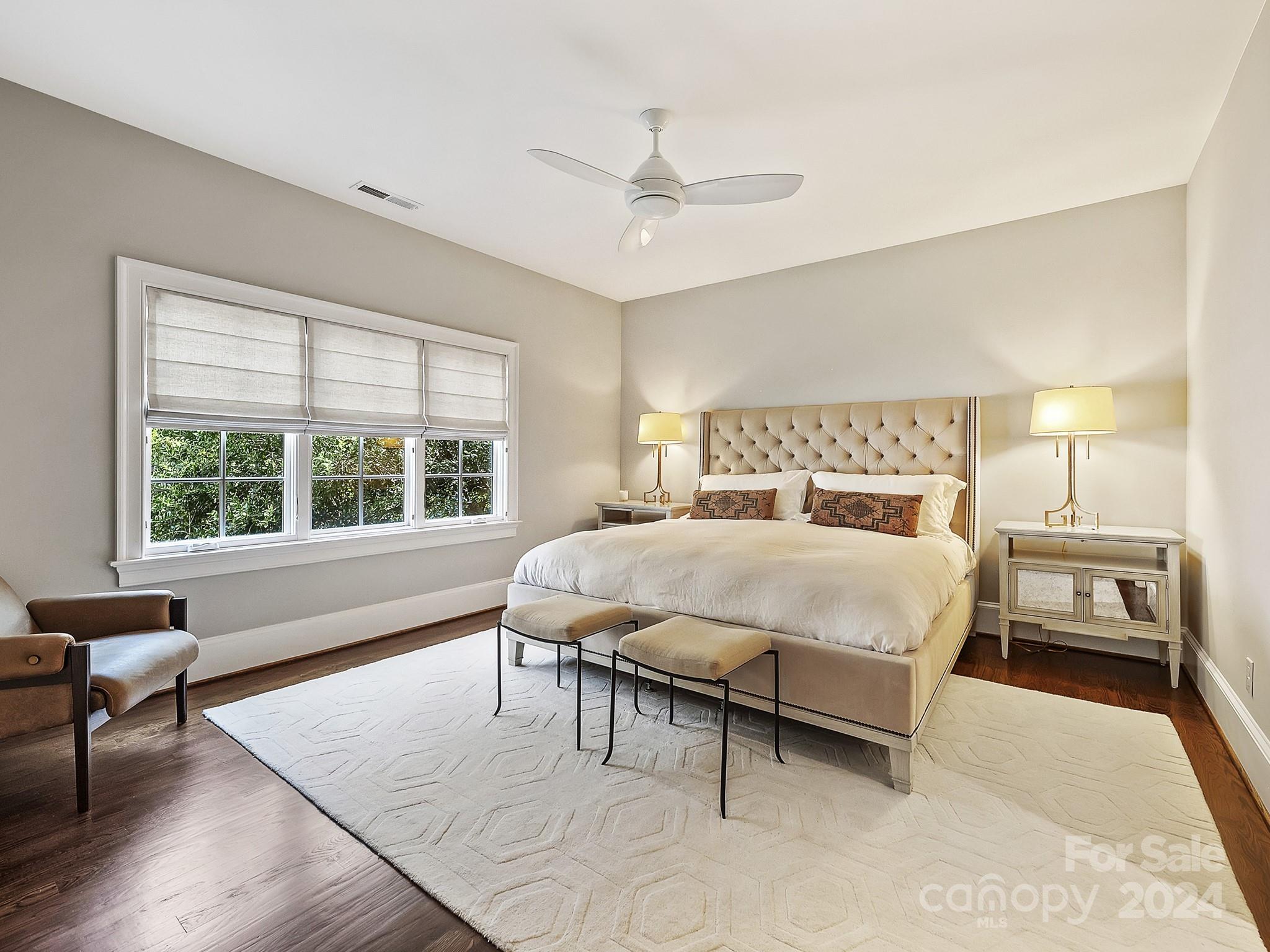 1621 Sterling Road Charlotte, NC 28209 - Photo 33 of 48 a bed sitting in a bedroom next to a window