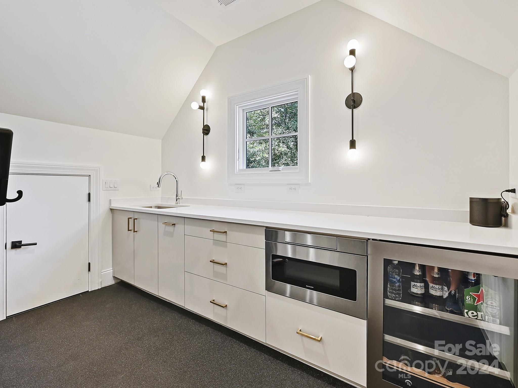 1621 Sterling Road Charlotte, NC 28209 - Photo 39 of 48 a kitchen with stainless steel appliances a sink and cabinets