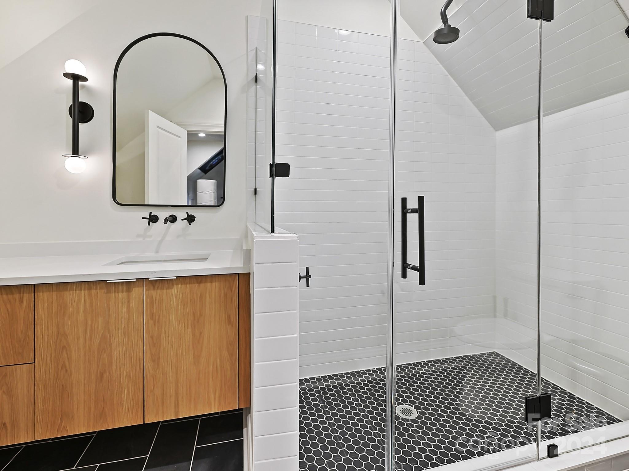 1621 Sterling Road Charlotte, NC 28209 - Photo 40 of 48 a bathroom with a sink and a mirror