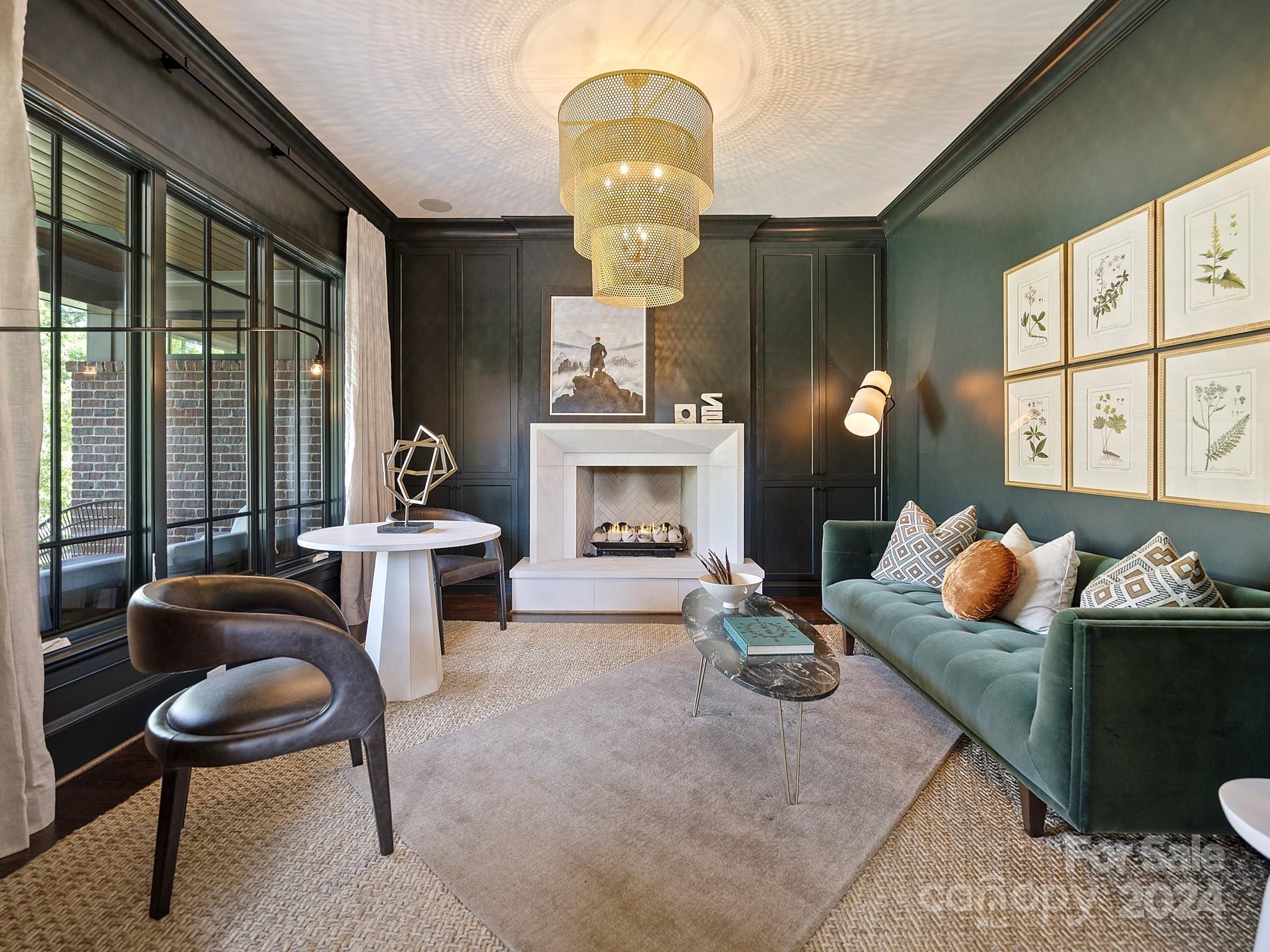 1621 Sterling Road Charlotte, NC 28209 - Photo 4 of 48 a living room with furniture chandelier and a fireplace