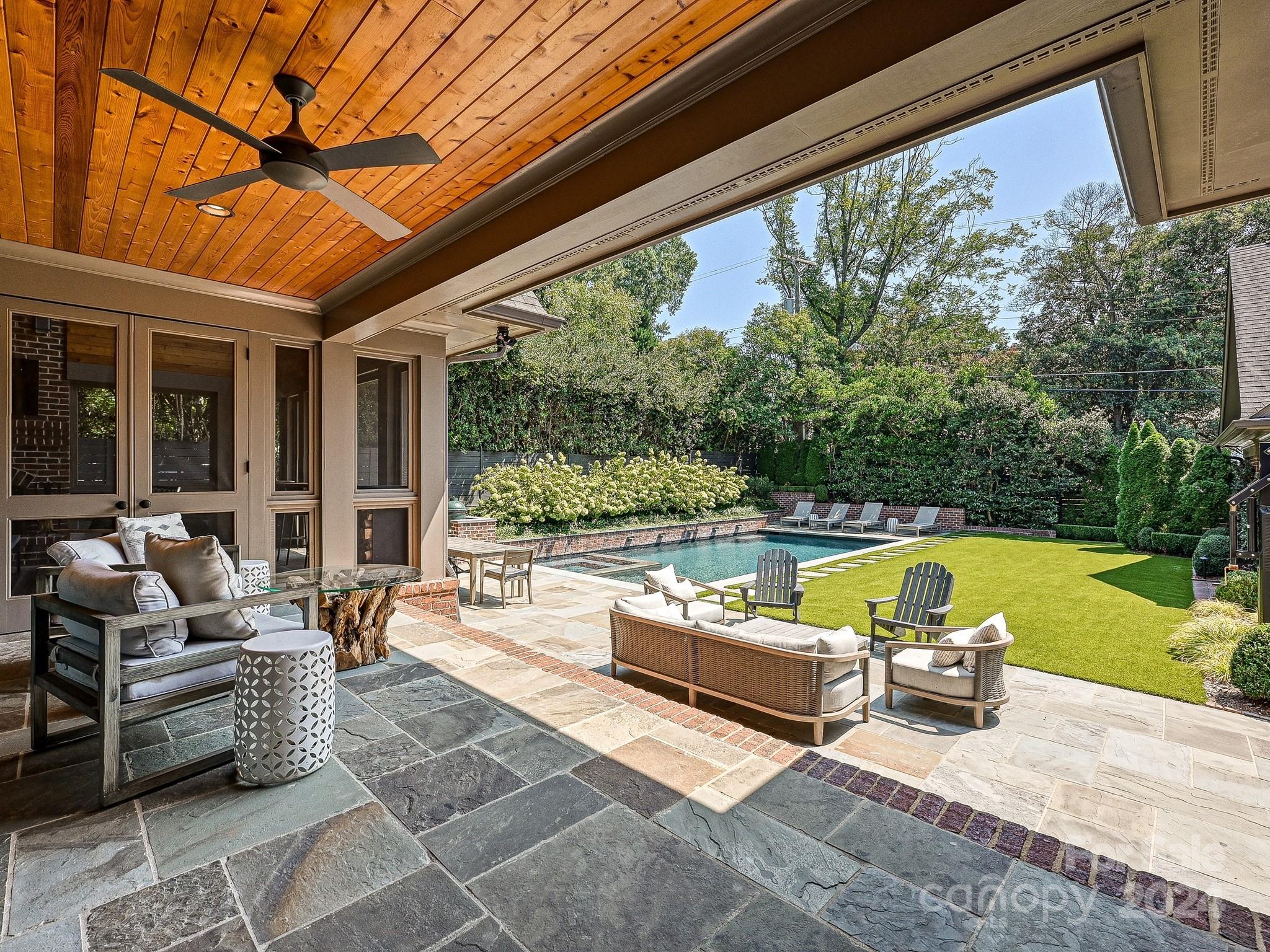 1621 Sterling Road Charlotte, NC 28209 - Photo 43 of 48 a living room with patio furniture and a swimming pool