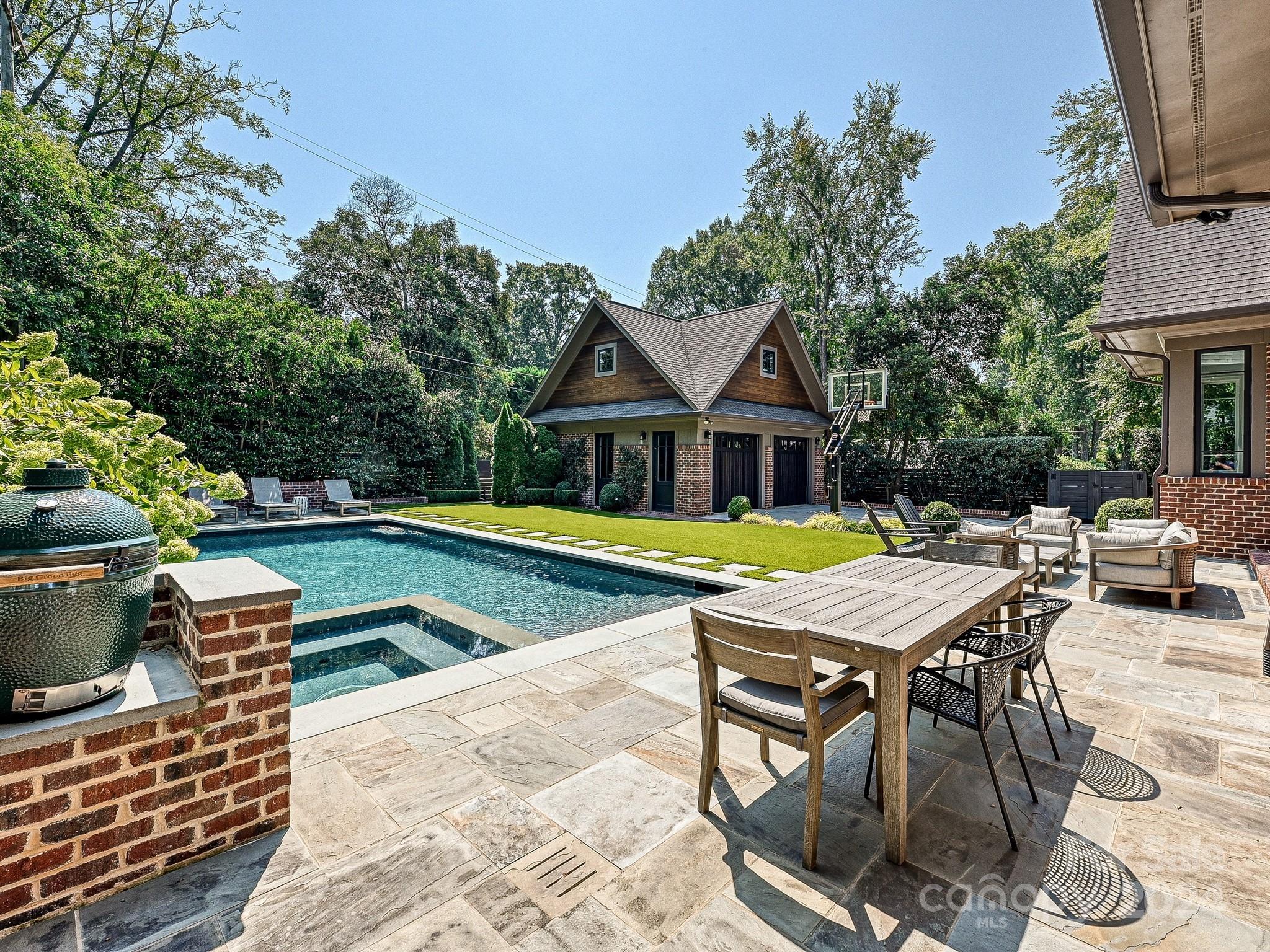 1621 Sterling Road Charlotte, NC 28209 - Photo 47 of 48 a view of house with yard outdoor seating and barbeque oven