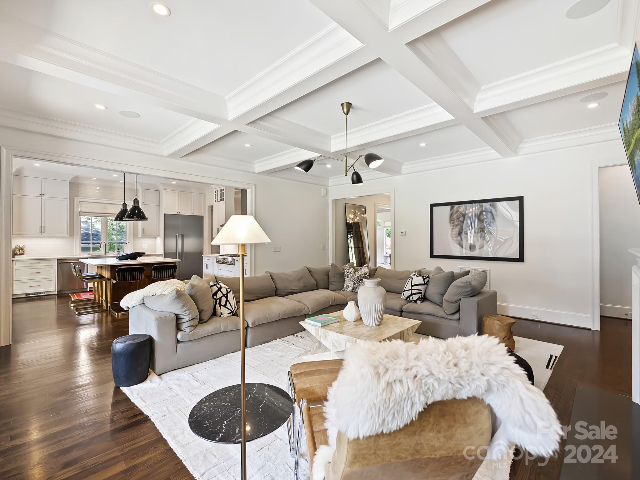 1621 Sterling Road Charlotte, NC 28209 - Photo 10 of 48 a living room with furniture a chandelier and a wooden floor