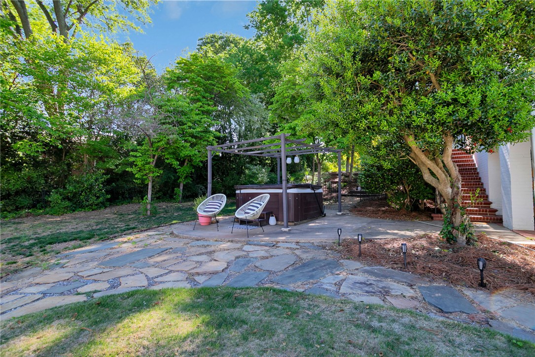 1107 Springdale Road Anderson, SC 29621 - Photo 42 of 49 Relax in the private spa nestled among lush greenery and natural stone pathways.