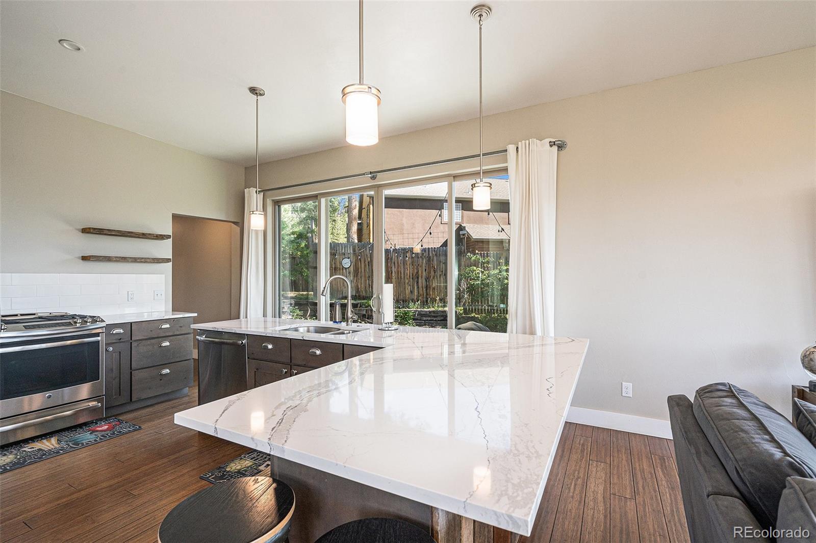 4650 Forest Hill Road Evergreen, CO 80439 - Photo 11 of 36 a very nice looking dining room with a large window