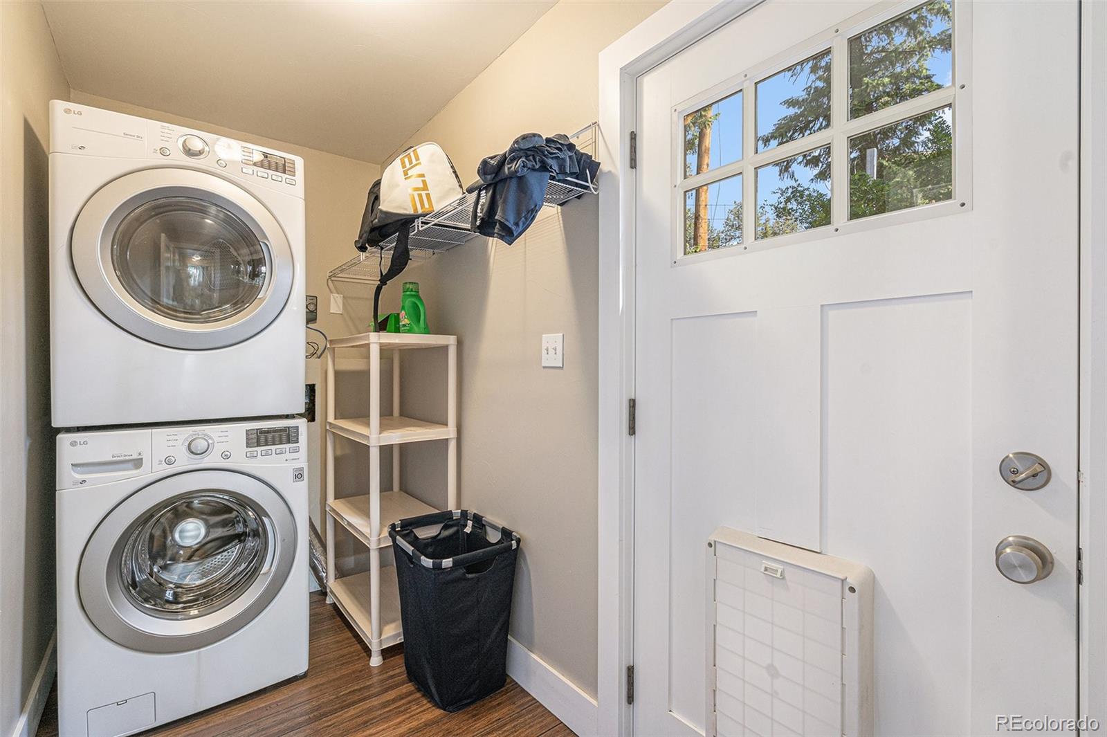 4650 Forest Hill Road Evergreen, CO 80439 - Photo 15 of 36 a view of a hallway with washer and dryer