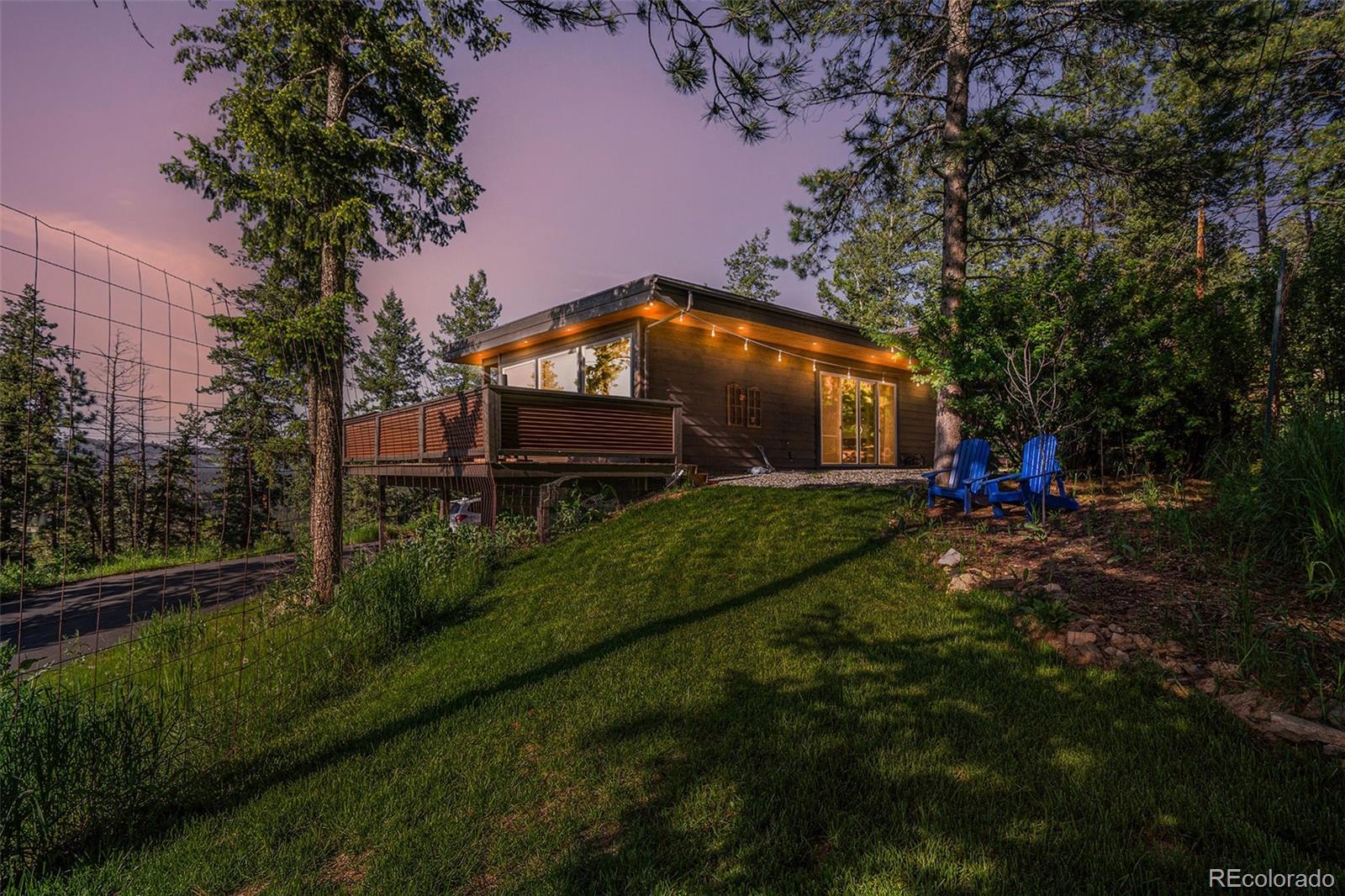 4650 Forest Hill Road Evergreen, CO 80439 - Photo 33 of 36 a garden view with a seating space