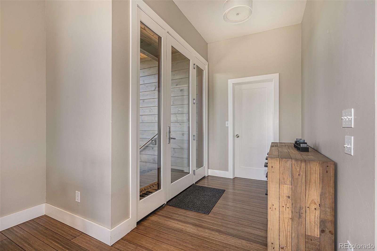 4650 Forest Hill Road Evergreen, CO 80439 - Photo 4 of 36 a view of hallway with wooden floor