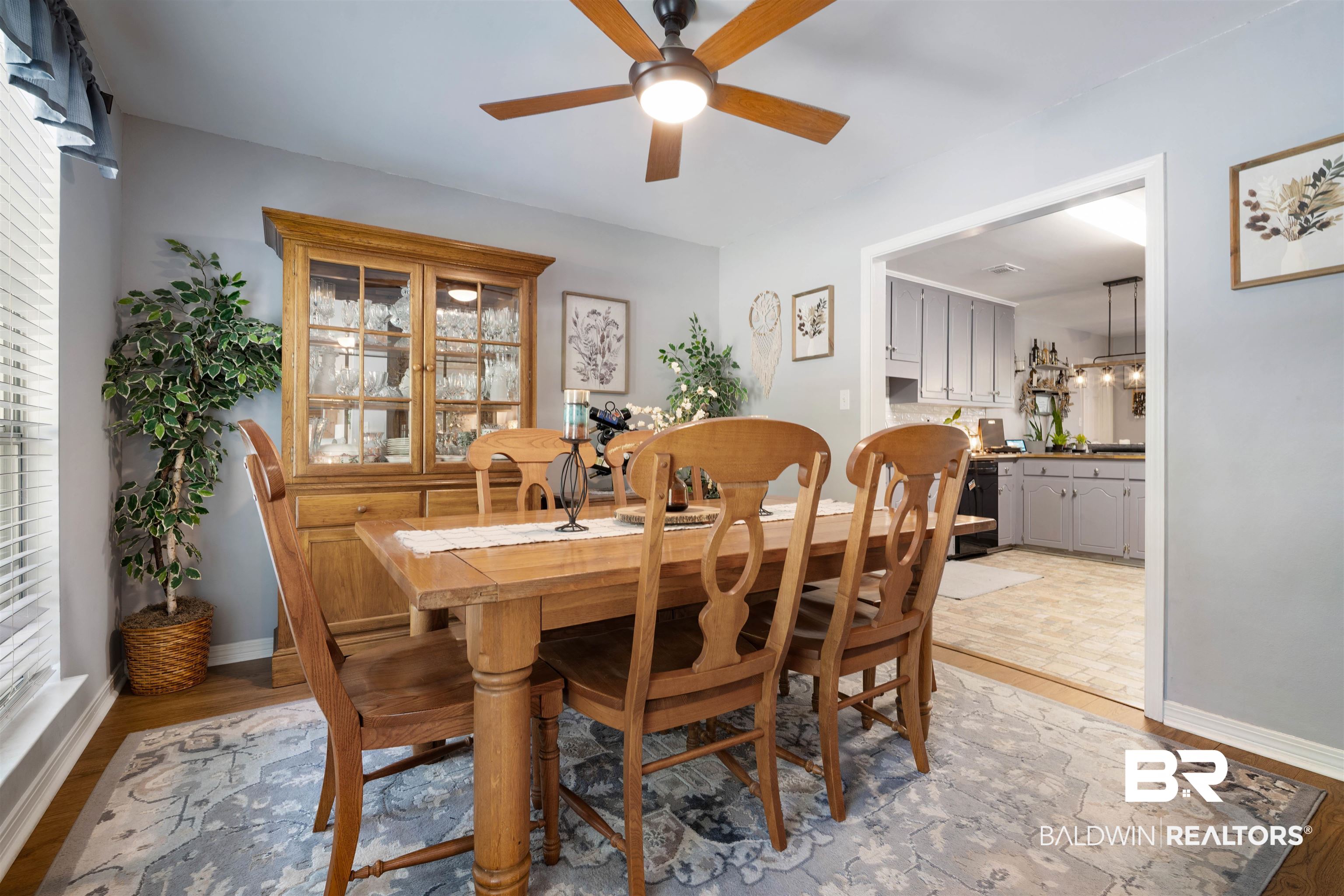 110 Lakeview Loop Daphne, AL 36526 - Photo 14 of 40 Dining area featuring light wood-type flooring, baseboards, and a ceiling fan