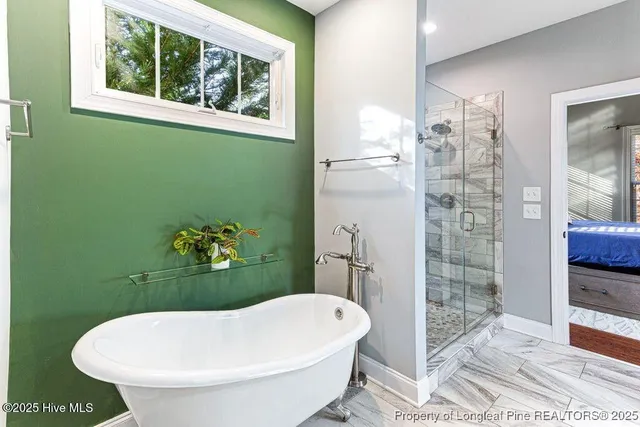 a view of walk in closet with clothes