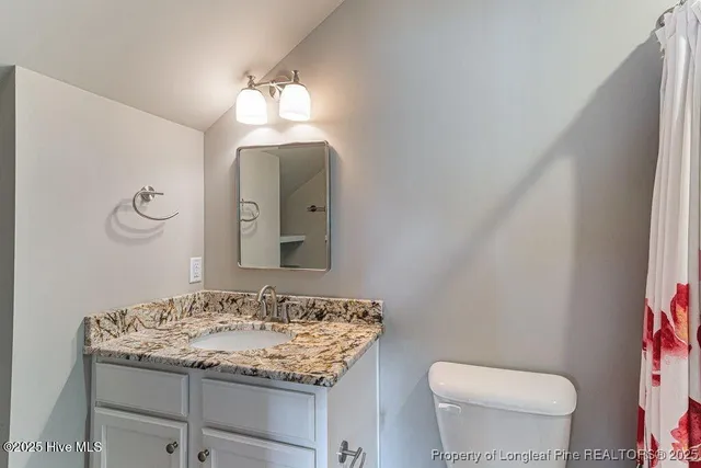 a view of balcony with wooden floor and outdoor seating