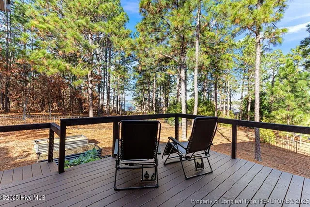 a backyard of a house with outdoor seating