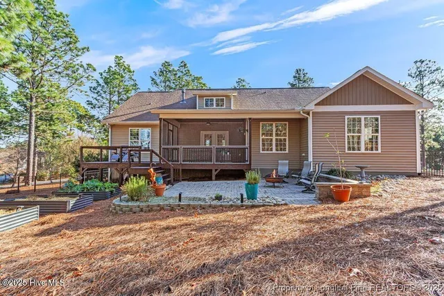 a front view of a house with a yard fountain and a fountain