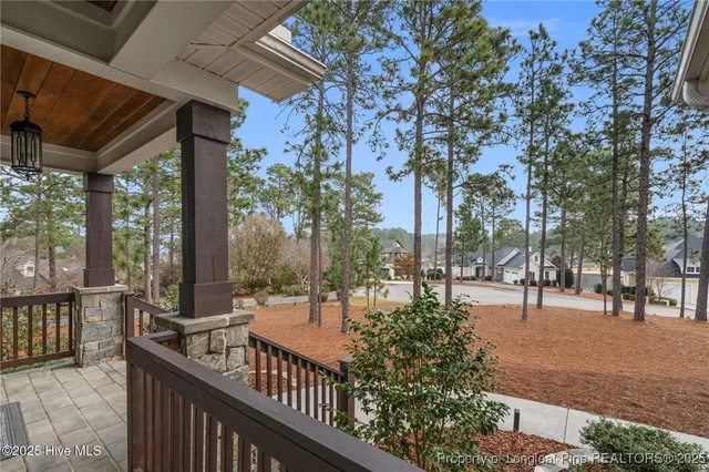 a view of a hallway with windows and entryway
