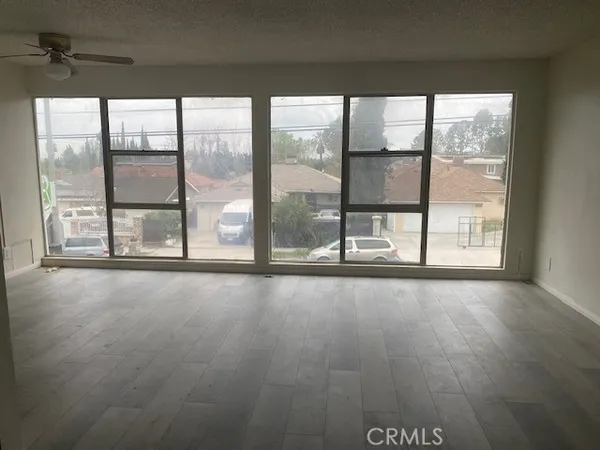 a view of an empty room with a window