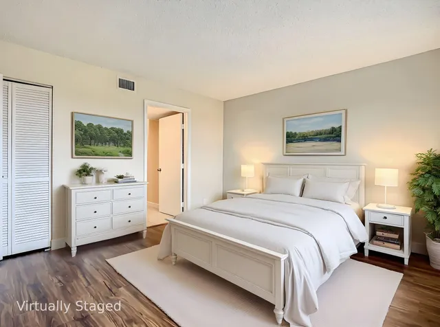 a bedroom with a bed and a dresser