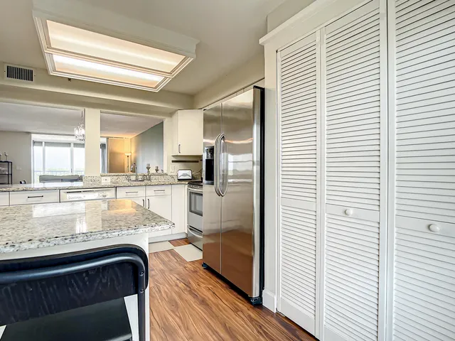 a view of a kitchen from the hallway