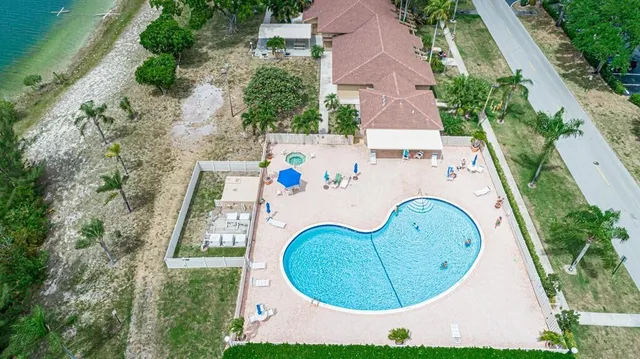 an aerial view of a house with swimming pool