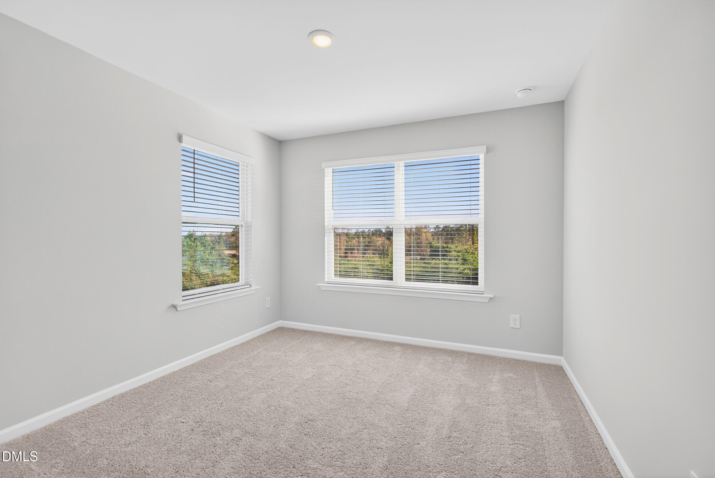 335 Chesapeake Commons Street Garner, NC 27529 - Photo 12 of 20 an empty room with a window