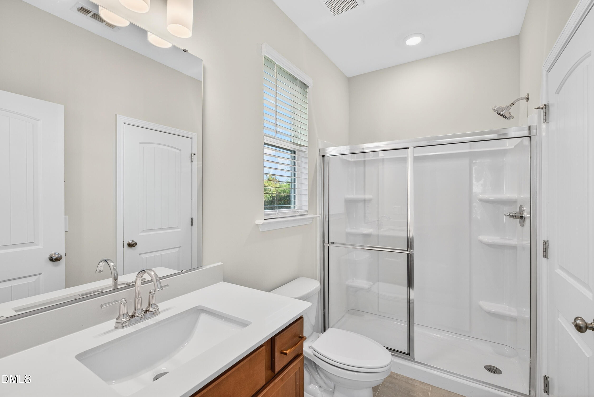 335 Chesapeake Commons Street Garner, NC 27529 - Photo 13 of 20 a bathroom with a sink toilet and shower