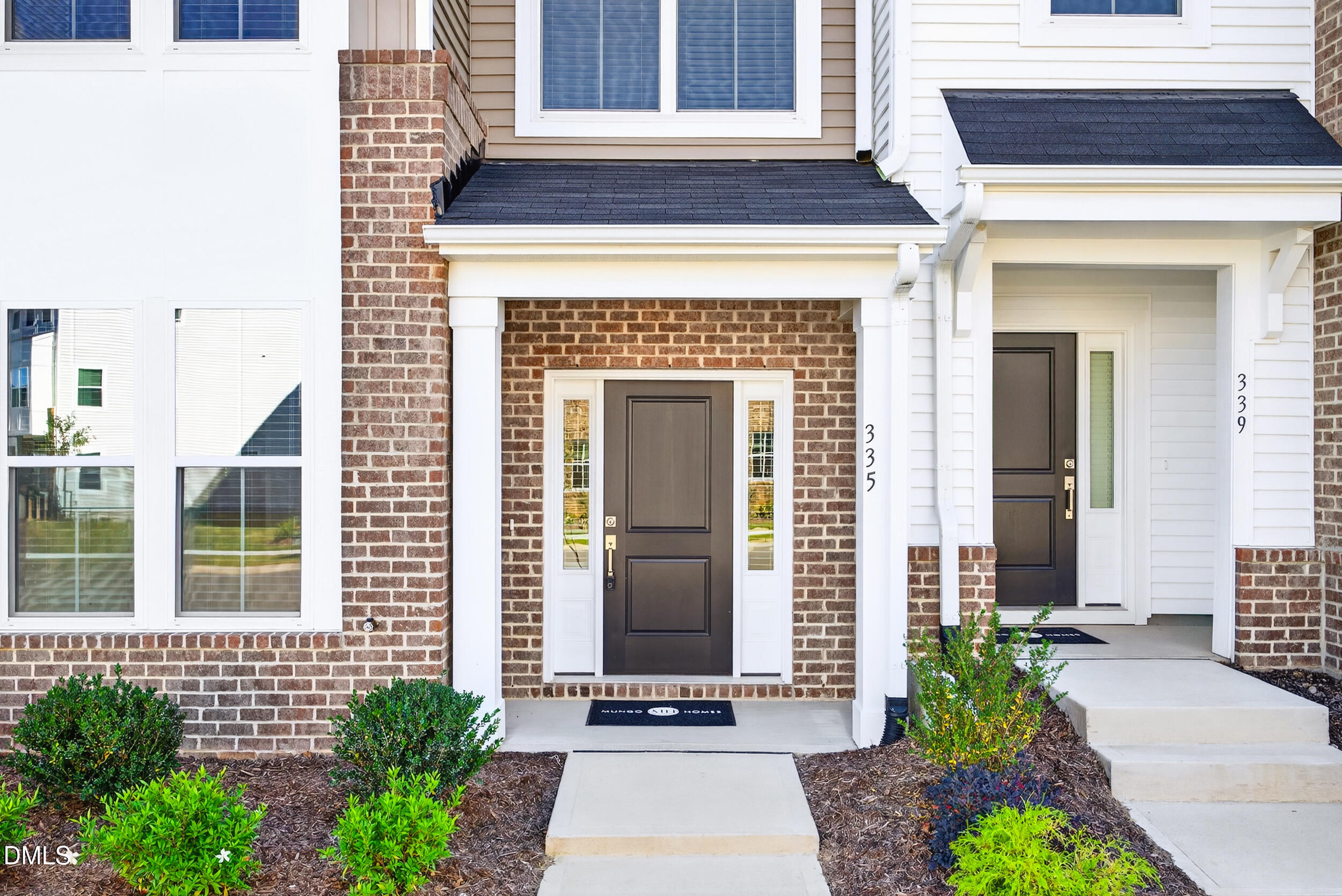 335 Chesapeake Commons Street Garner, NC 27529 - Photo 3 of 20 a front view of a house with garden