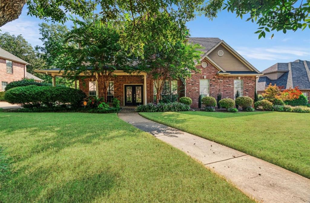 a front view of a house with yard