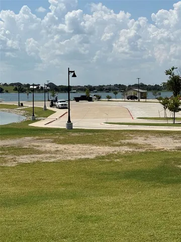 a view of a large swimming pool and a lake