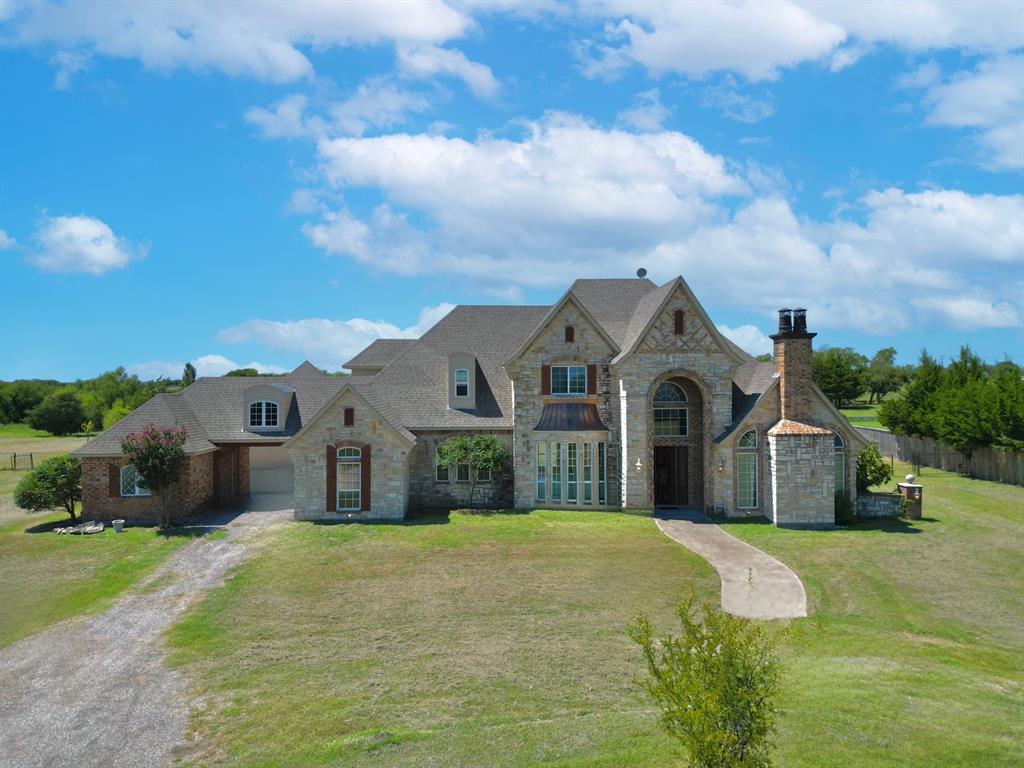 4026 Howard Road Waxahachie, TX 75165 - Photo 2 of 37 a front view of a house with a yard