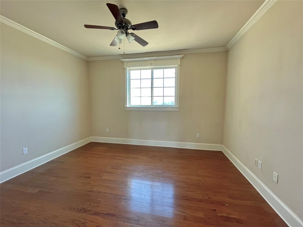 4026 Howard Road Waxahachie, TX 75165 - Photo 35 of 37 an empty room with wooden floor and windows