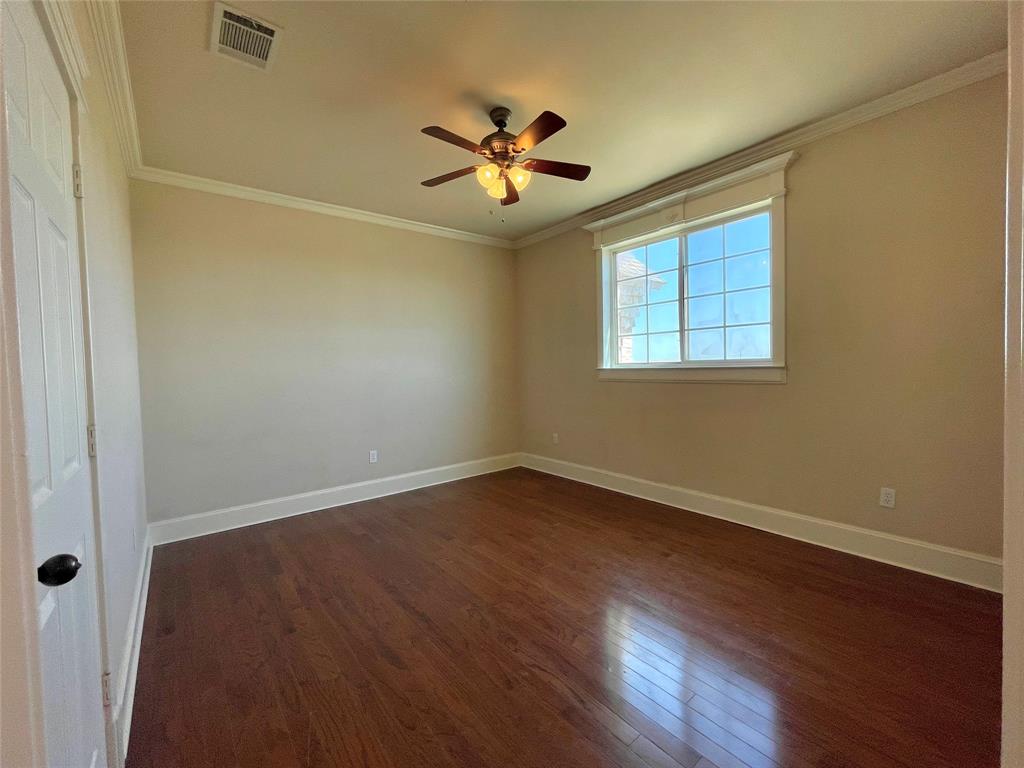 4026 Howard Road Waxahachie, TX 75165 - Photo 36 of 37 a view of an empty room with wooden floor and a window