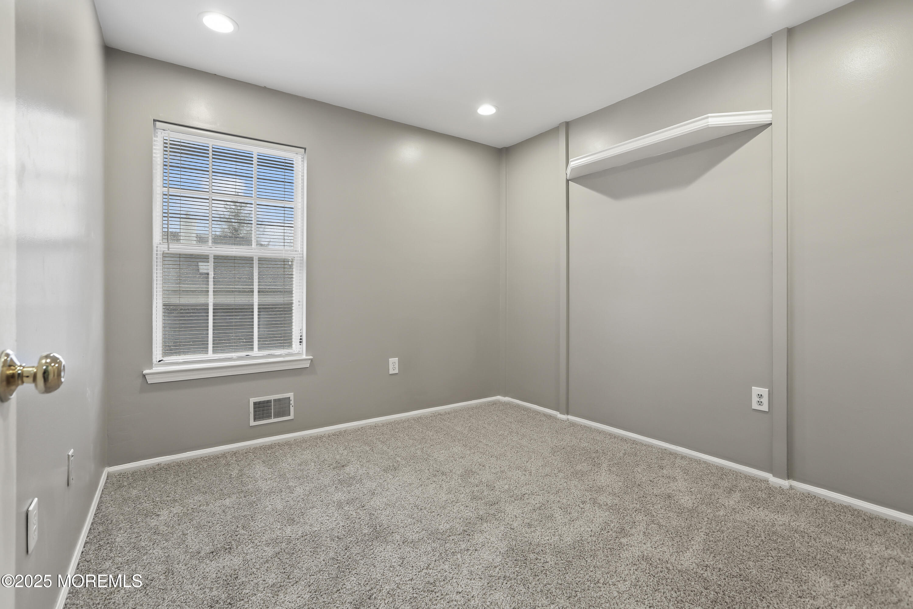 1707 Ridgeview Court, Unit 1707 Parlin, NJ 08859 - Photo 14 of 22 a view of an empty room with a window