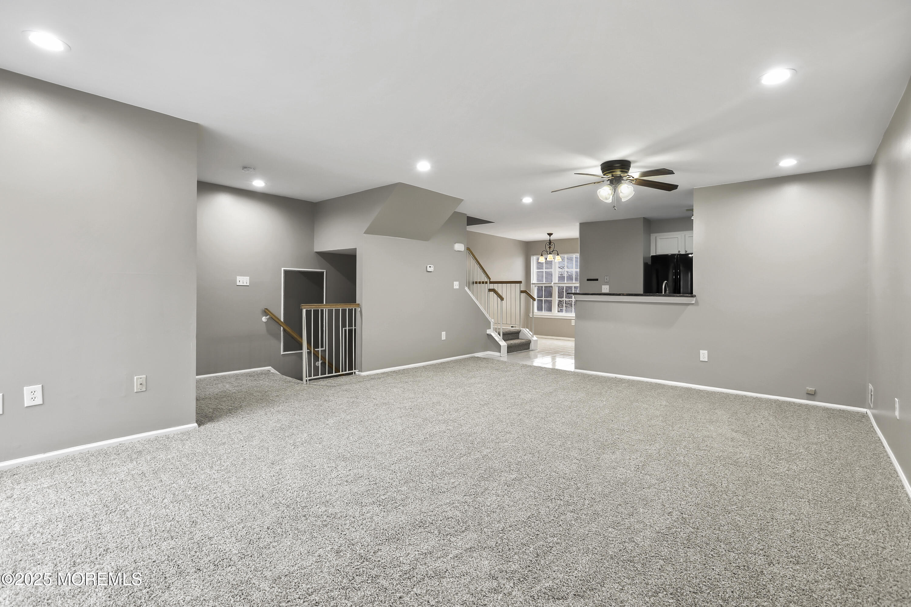 1707 Ridgeview Court, Unit 1707 Parlin, NJ 08859 - Photo 4 of 22 an empty room with a kitchen and a sink