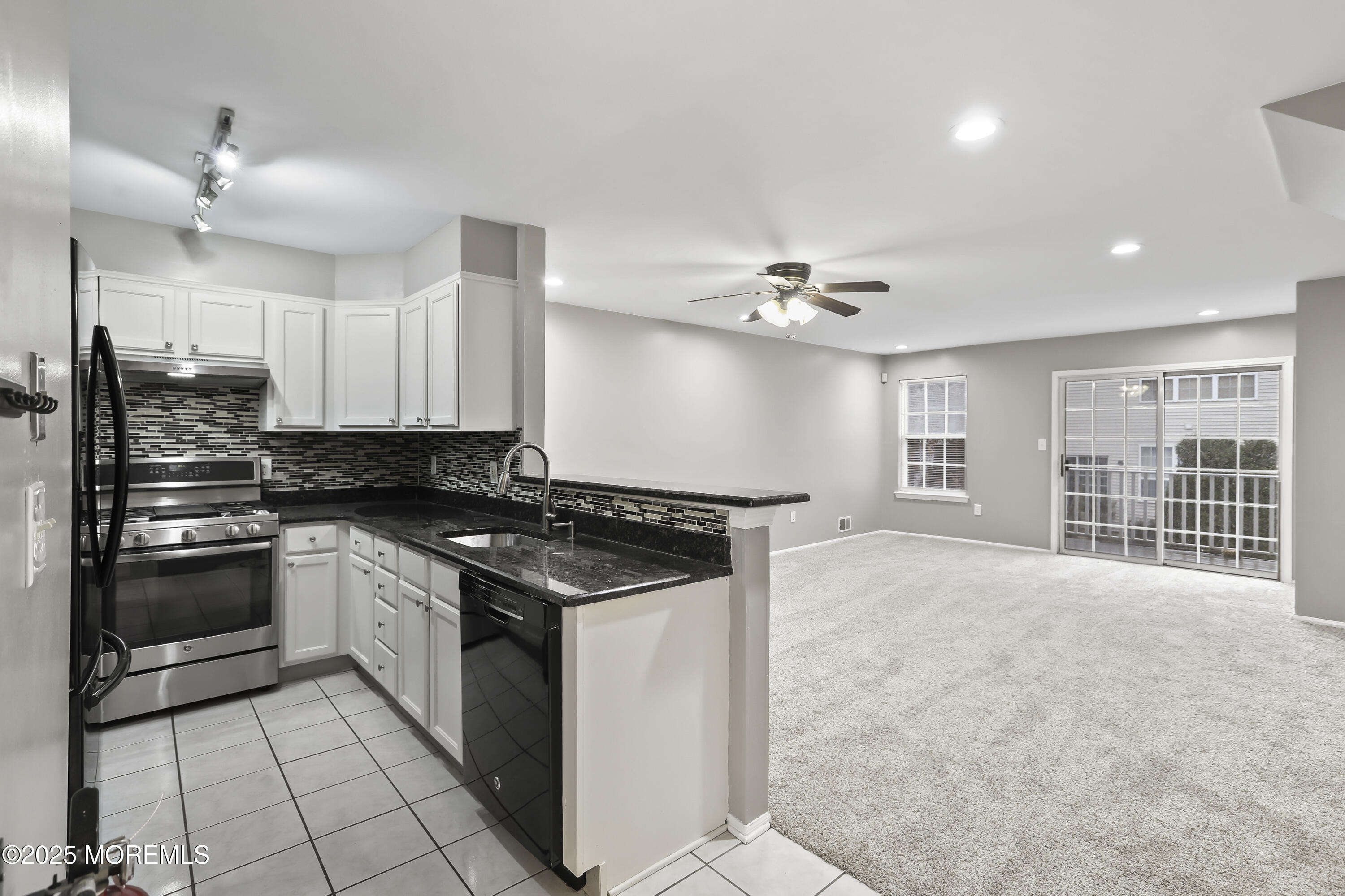 1707 Ridgeview Court, Unit 1707 Parlin, NJ 08859 - Photo 6 of 22 a kitchen with stainless steel appliances granite countertop a stove and a sink