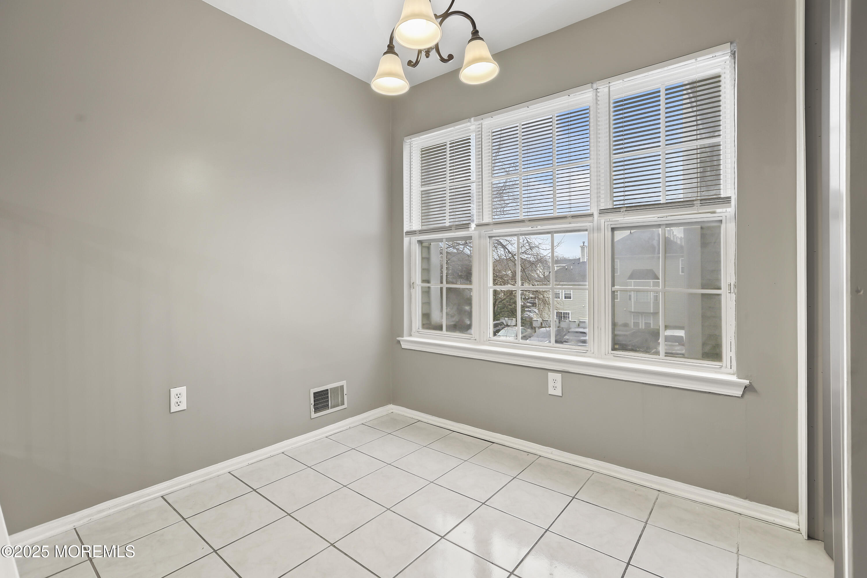 1707 Ridgeview Court, Unit 1707 Parlin, NJ 08859 - Photo 9 of 22 a view of an empty room with a window