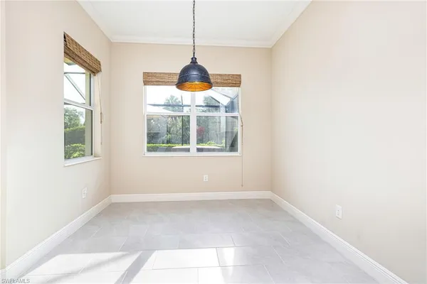 a room with window and ceiling fan