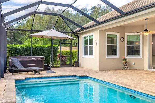 a house view with a seating space and garden