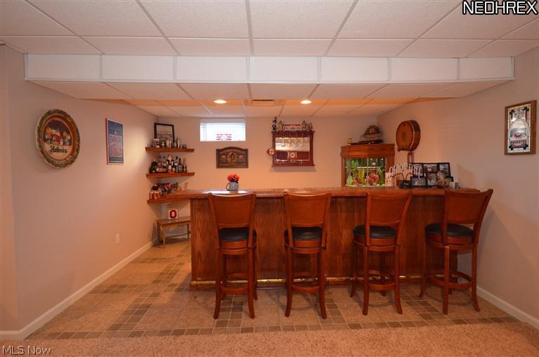 218 Sandstone Ridge Way Berea, OH 44017 - Photo 18 of 25 You can't beat this bar! Notice the built in fish tank and corner shelves too.