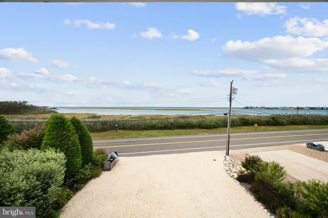 a living room with furniture a rug and a chandelier