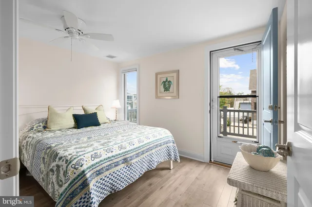 a bedroom with two beds and a window