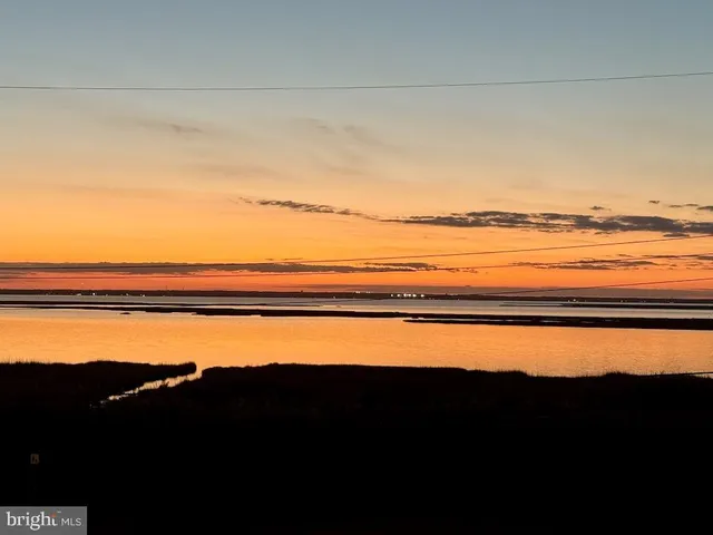 an aerial view of a house with a terrace outdoor seating