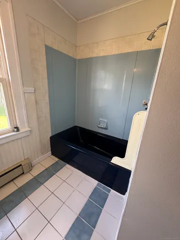 a view of stairs and an entrance door