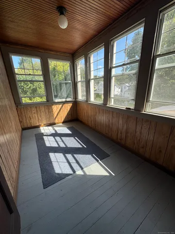 a view of an empty room with windows